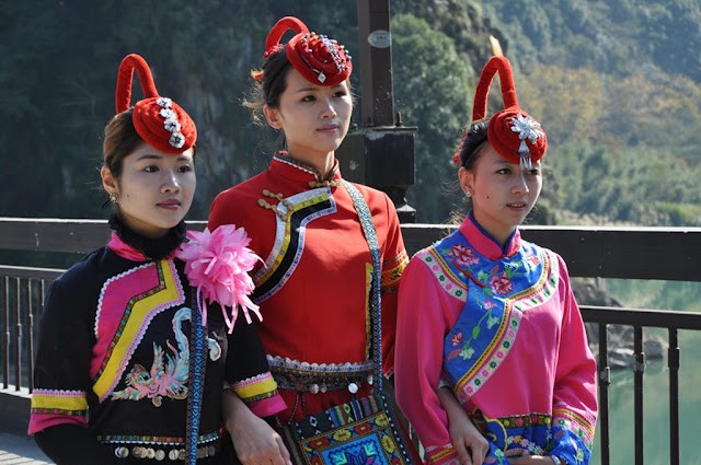 A She woman in traditional attire, demonstrating the craftsmanship and attention to detail in their cultural clothing.