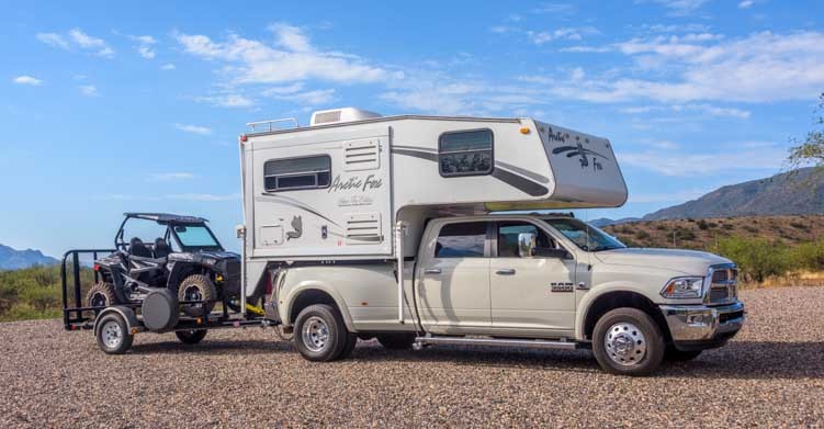Arctic Fox 860 Truck Camper towing Polaris 900 RZR
