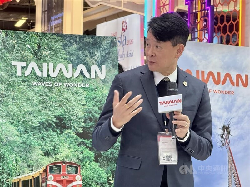 Alishan National Scenic Area Headquarters Director Huang Shih-fang speaks at ITB Berlin, highlighting Taiwan's scenic beauty.