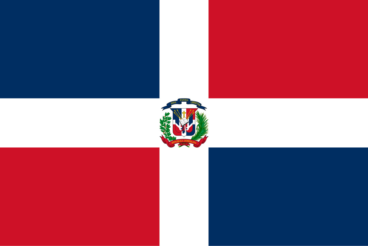 Dominican Republic flag waving against a clear blue sky, symbolizing national identity and tourism promotion