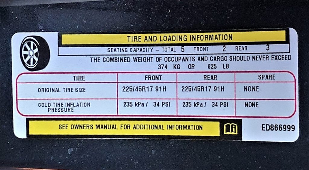Tire and loading sticker showing the vehicle’s original tires and their recommended PSI.