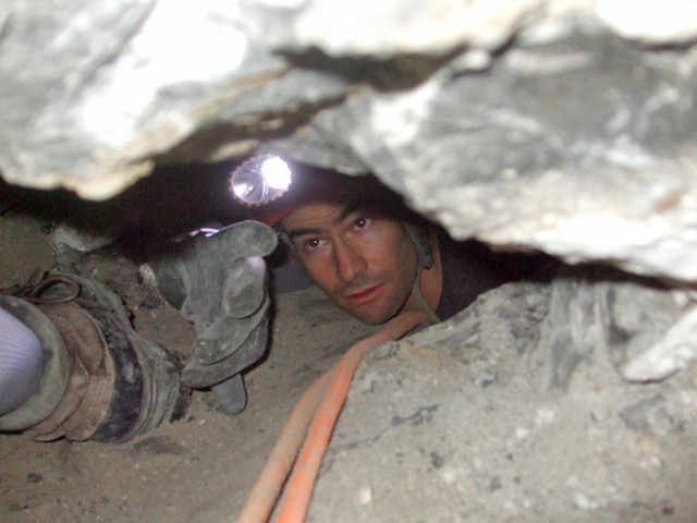 Me between D7 and D9 just above John. I”m showing how I can touch the ceiling and floor at the same time with my hand.