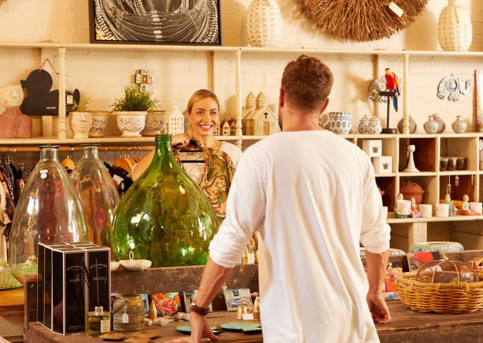 A couple shopping at Finns Store, exploring local homewares and crafts