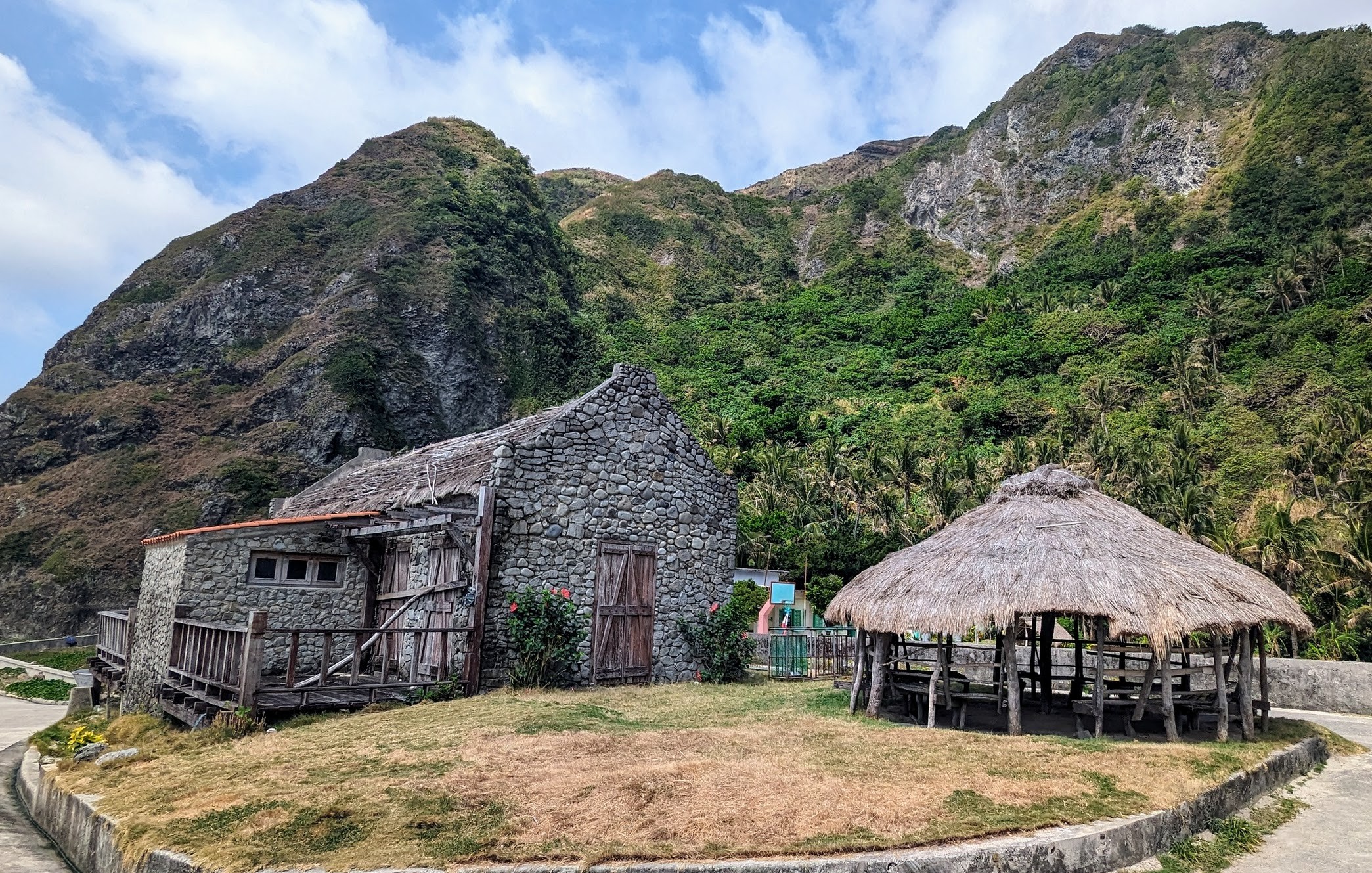 Traditional Ivatan houses seamlessly blend with the surrounding landscapes in Chavayan village