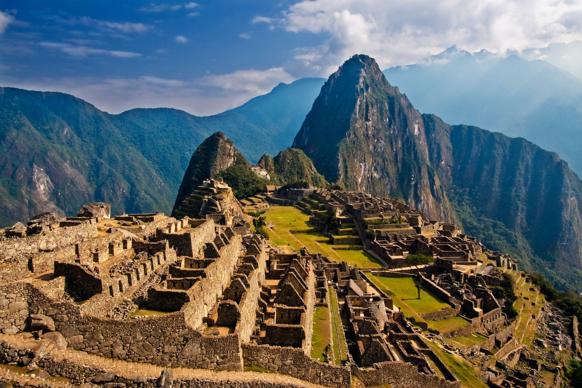 Machu Picchu Incan citadel in Peru against mountains with clear blue sky