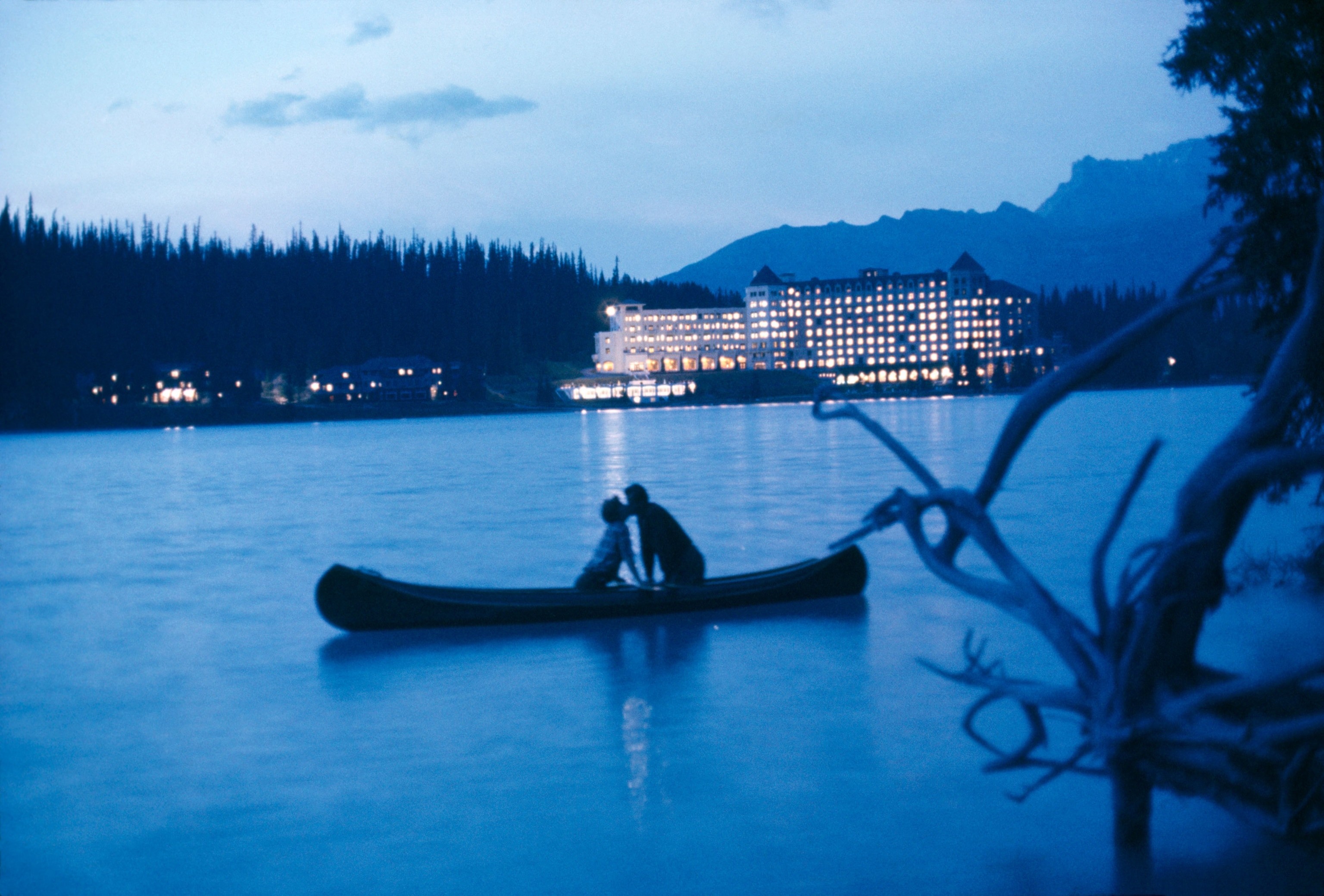 Couple kissing on Lake Louise in Alberta, Canada