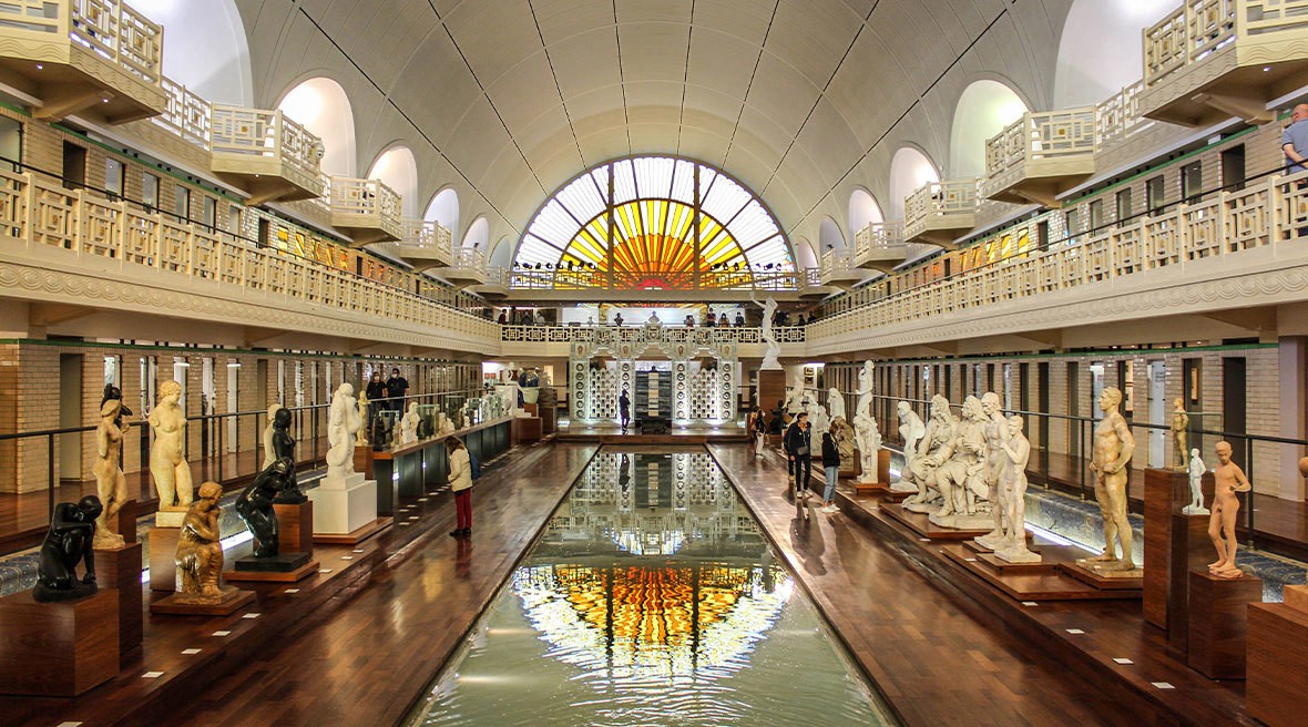 Art Deco swimming pool with stained glass and marble statues