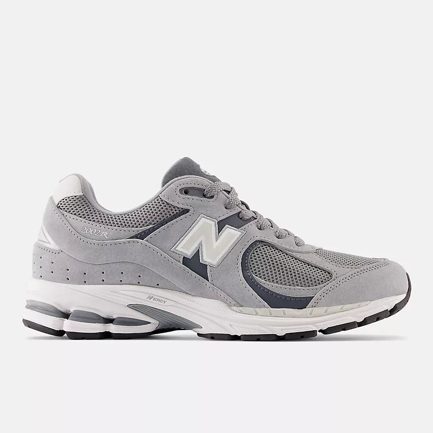 Comfortable grey and white New Balance 2002R sneakers for walking long distances