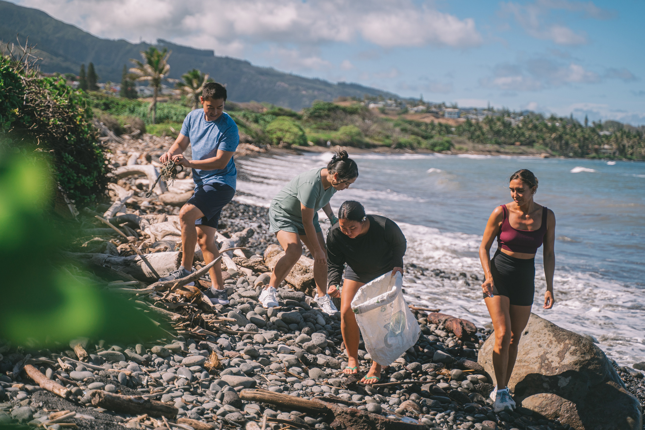 Volunteers cleaning a beach in Maui
