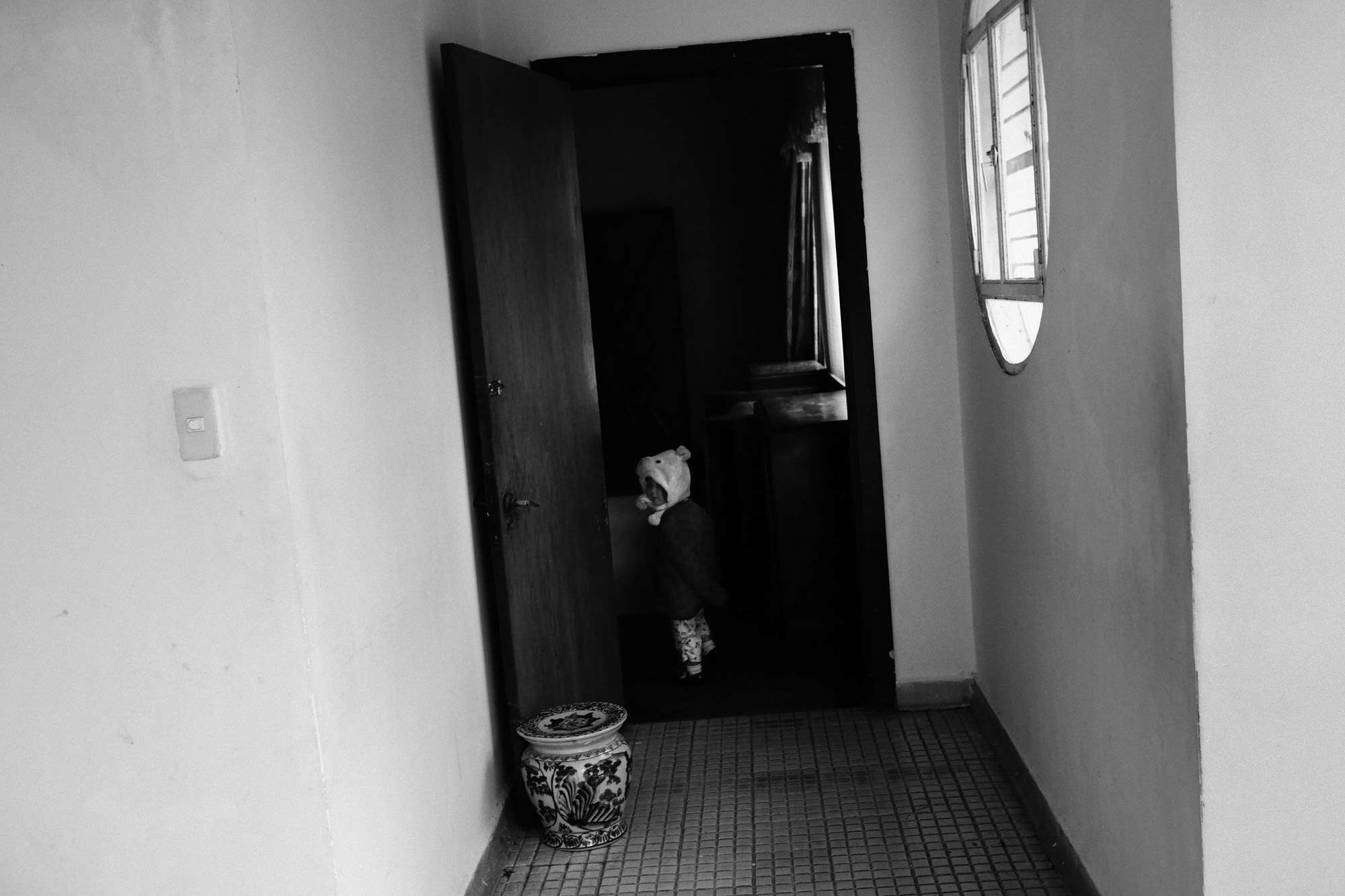 A photographer in Da Lat using an Olympus Pen-F with a 17mm lens, showcasing a compact alternative to DSLRs