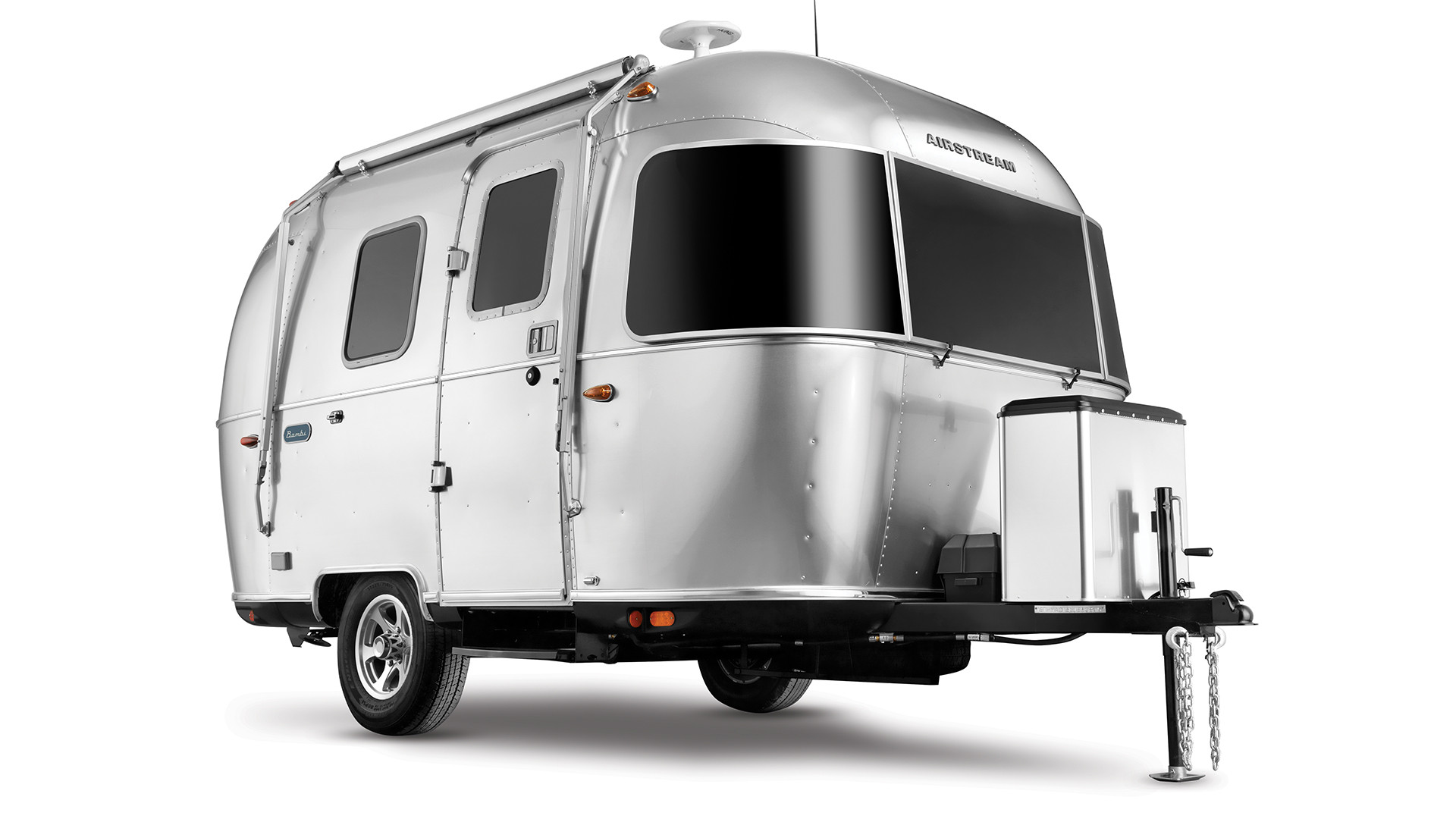 A 16-foot travel trailer parked amidst scenic Vietnamese mountains, showcasing its compact size and suitability for exploring remote areas