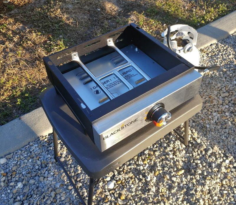 After removing the griddle from the box. Before putting the griddle surface on the burner.