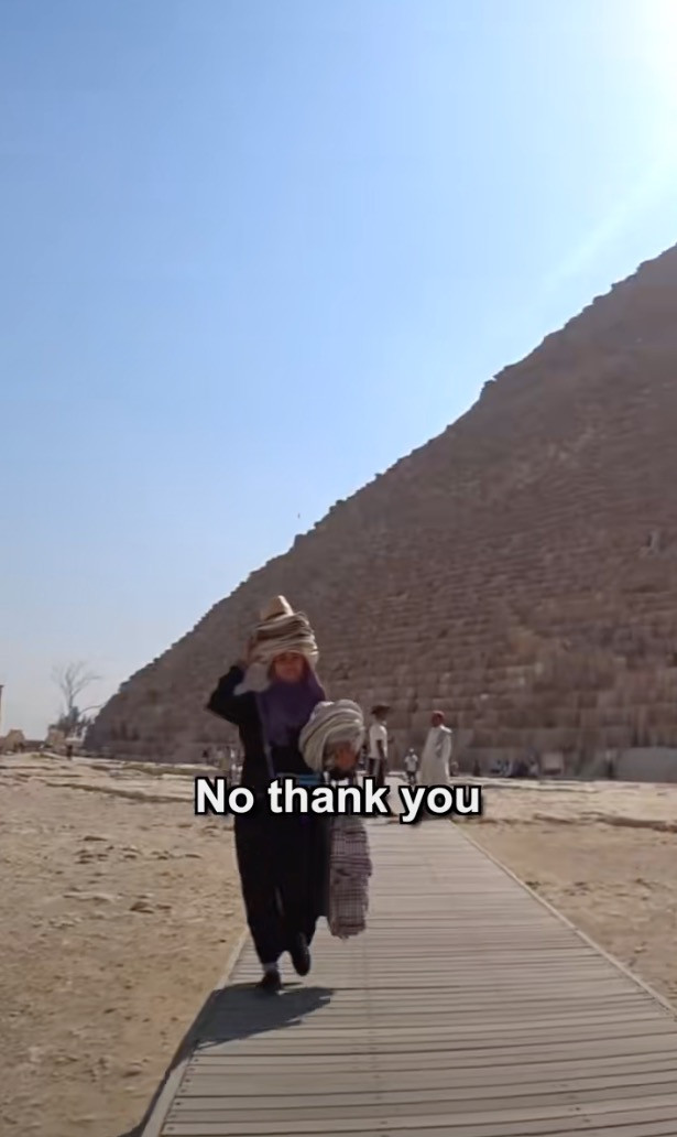 Caz filmed himself being followed by Egyptian men near the pyramids.
