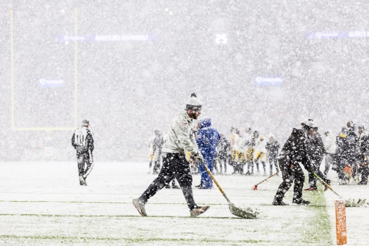 Grounds crew clearing snow
