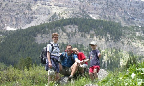 Hikers enjoying a scenic trail in Grand Teton National Park, with majestic mountains in the backdrop
