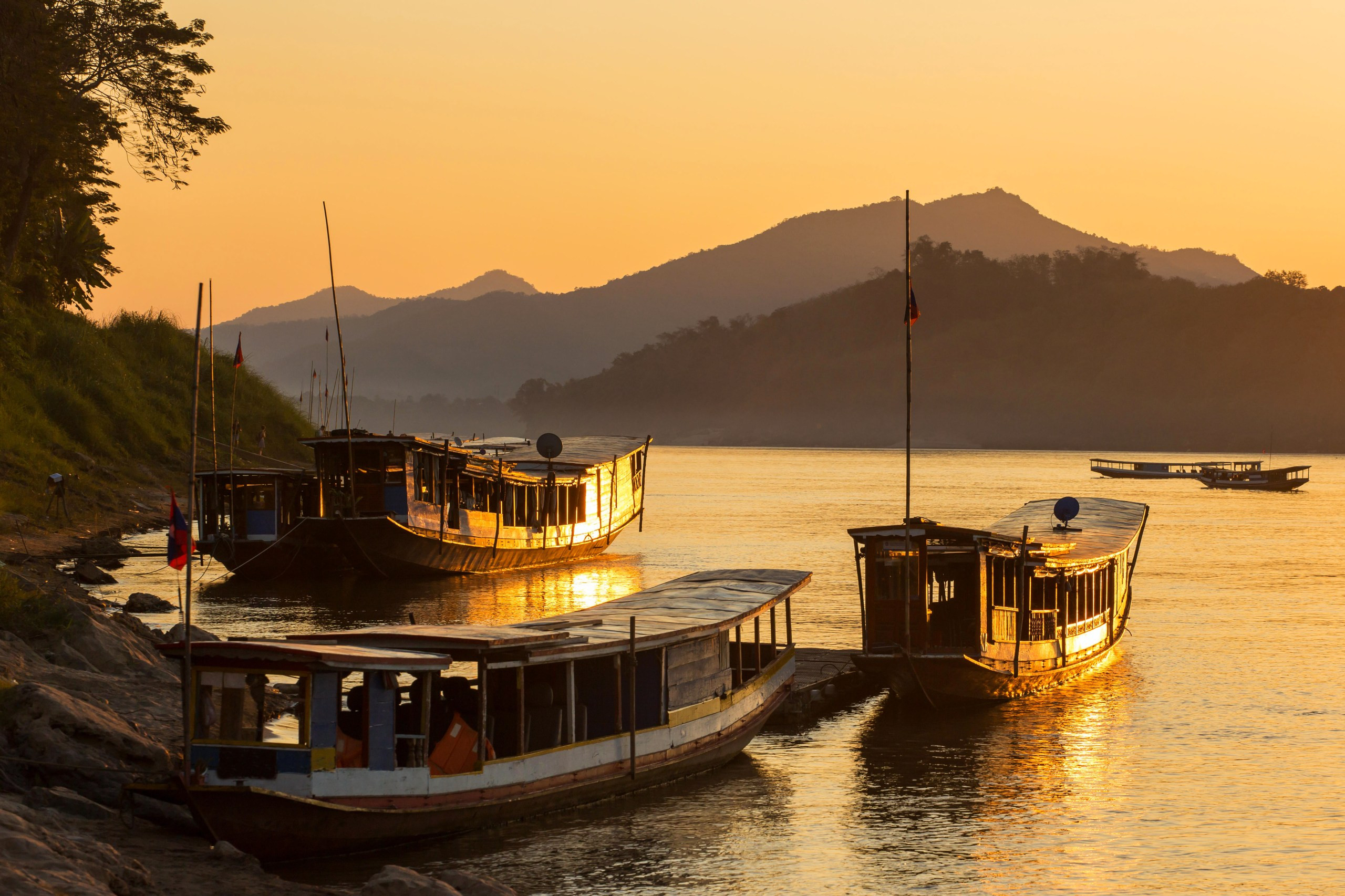 Boats on the Mekong at Luang Prabang in Laos, a great place to go on holiday in December