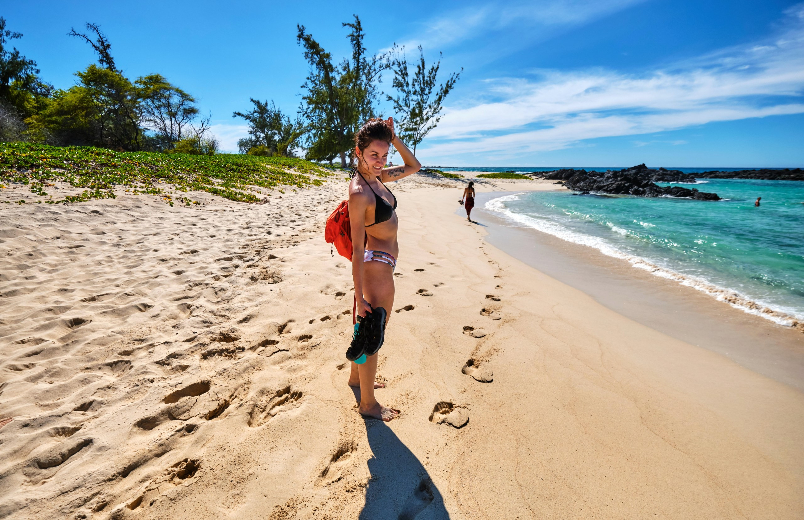 Makalawena beach in Hawaii, featuring white sand coves and clear blue waters