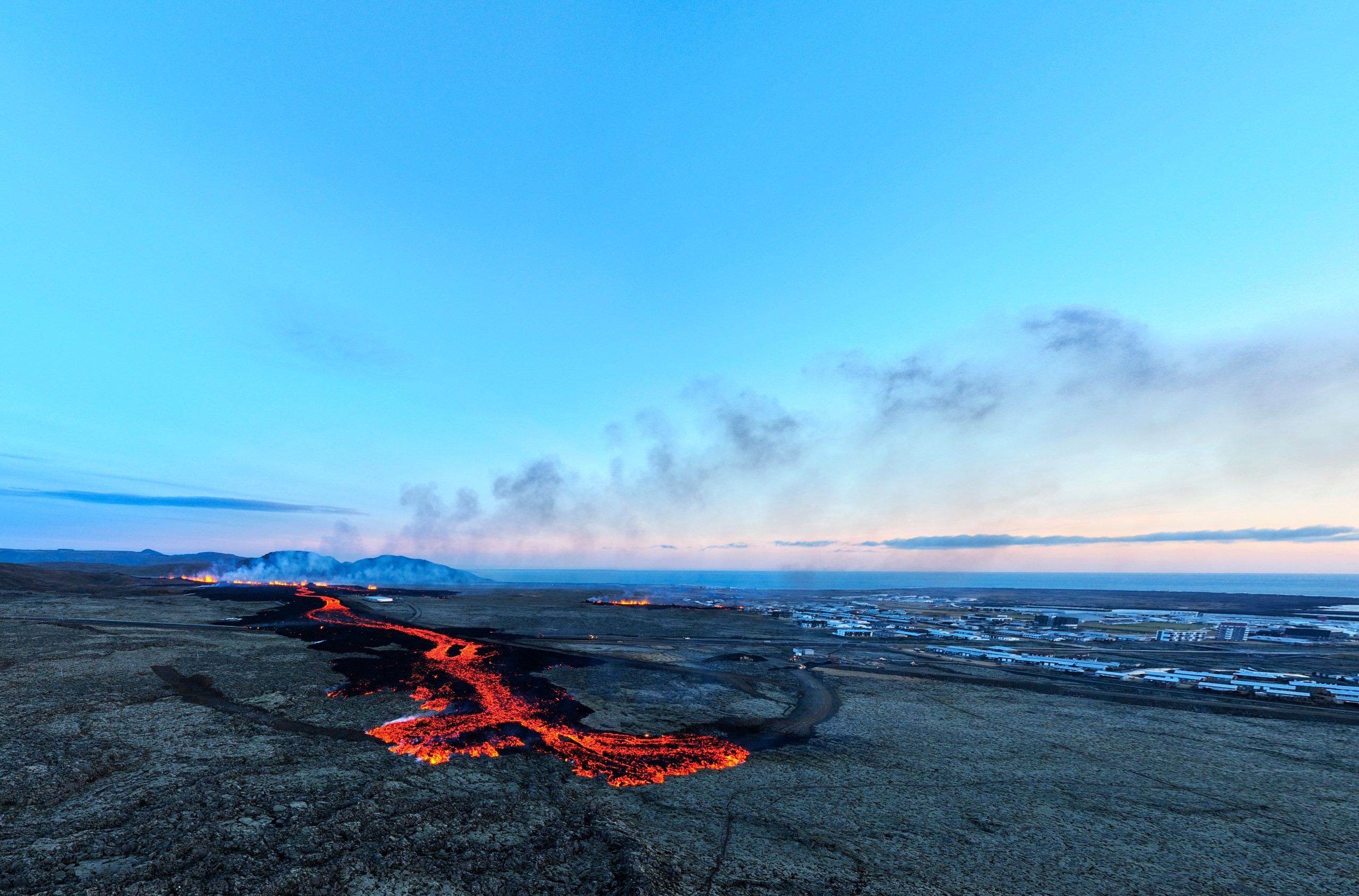 Lava field illuminated at dusk near Grindavik, Iceland, showcasing the volcanic landscape