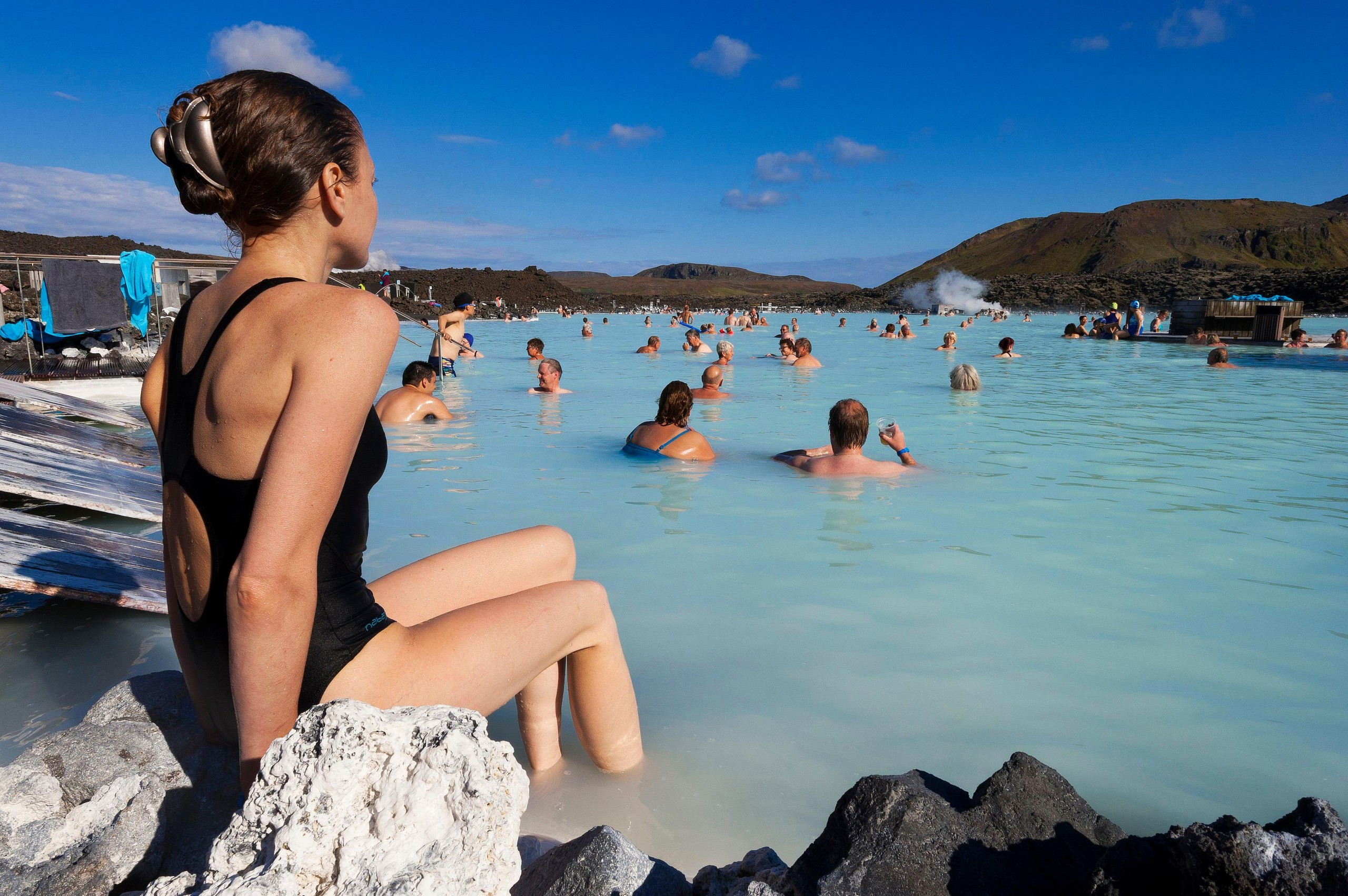 People enjoying a soak in the geothermal waters of the Blue Lagoon in Iceland