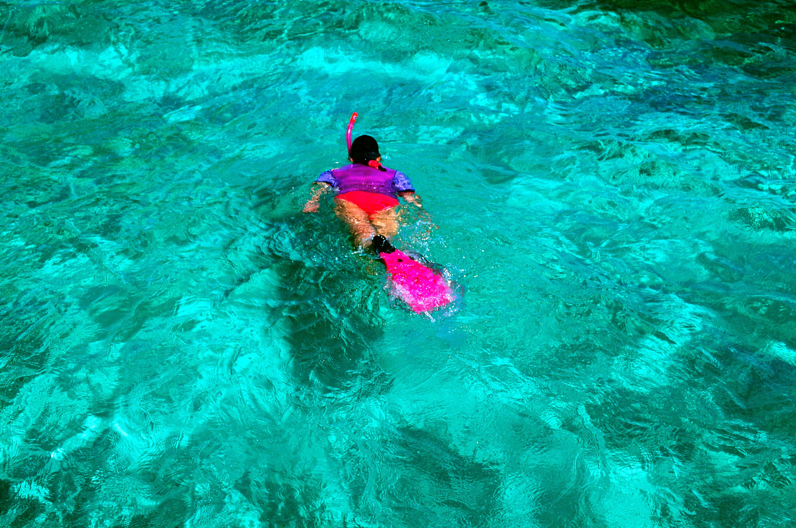 Snorkeling at Ambergris Caye, highlighting the stunning coral gardens