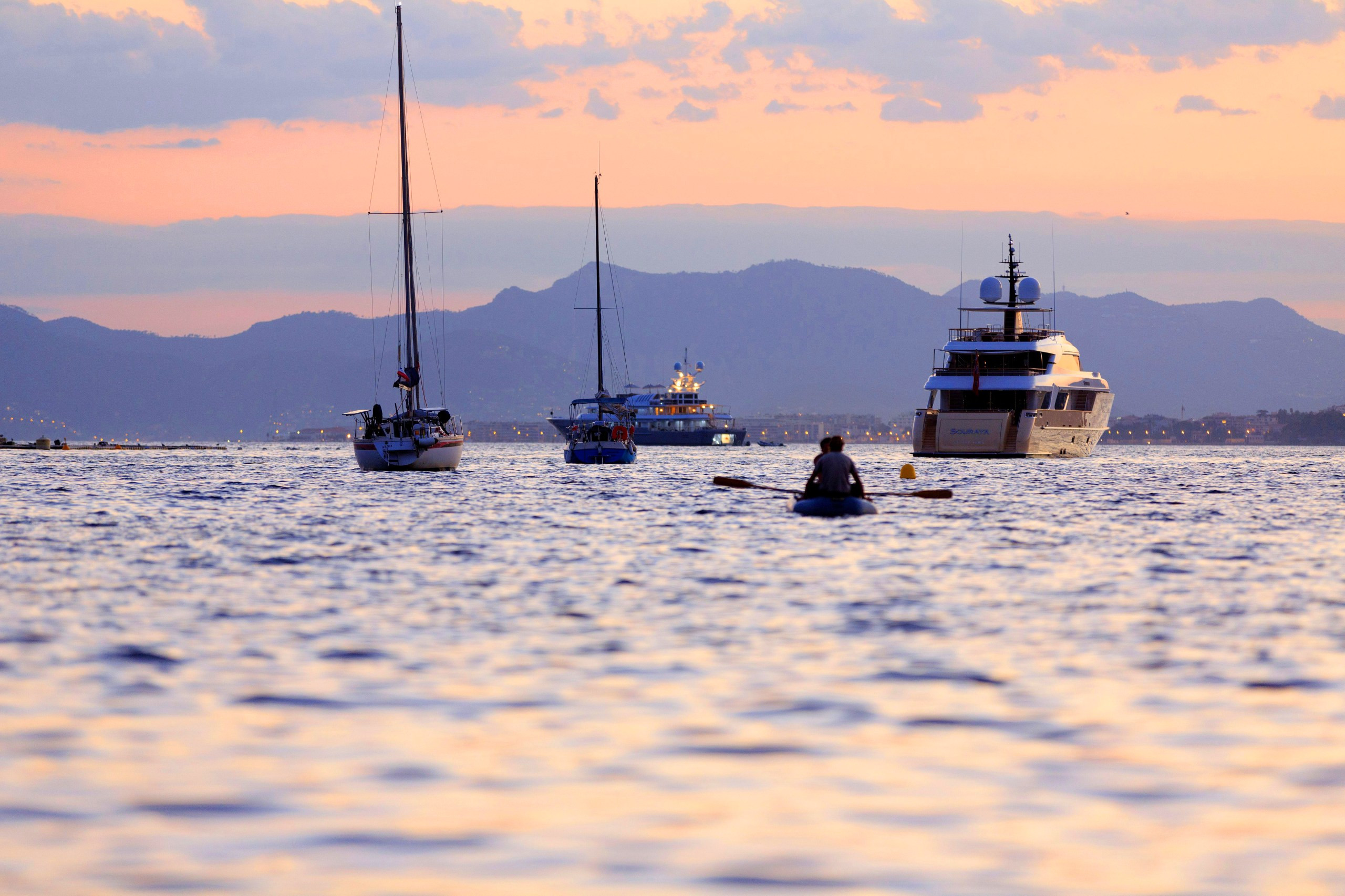 The Côte d’Azur, France, featuring a coastal town with yachts and colorful buildings