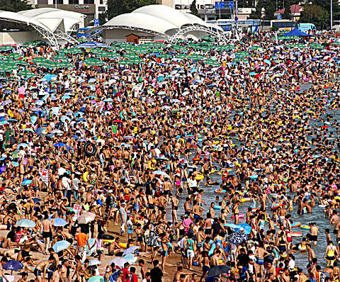 Crowded beach in China, showcasing mass tourism