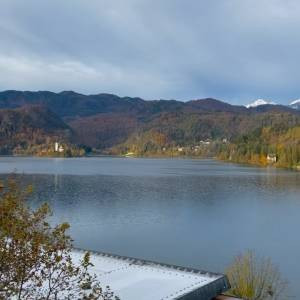 Autumn foliage around Lake Bled creating vibrant colors. Alt text: Slovenia Lake Bled autumn scenic view with colorful trees