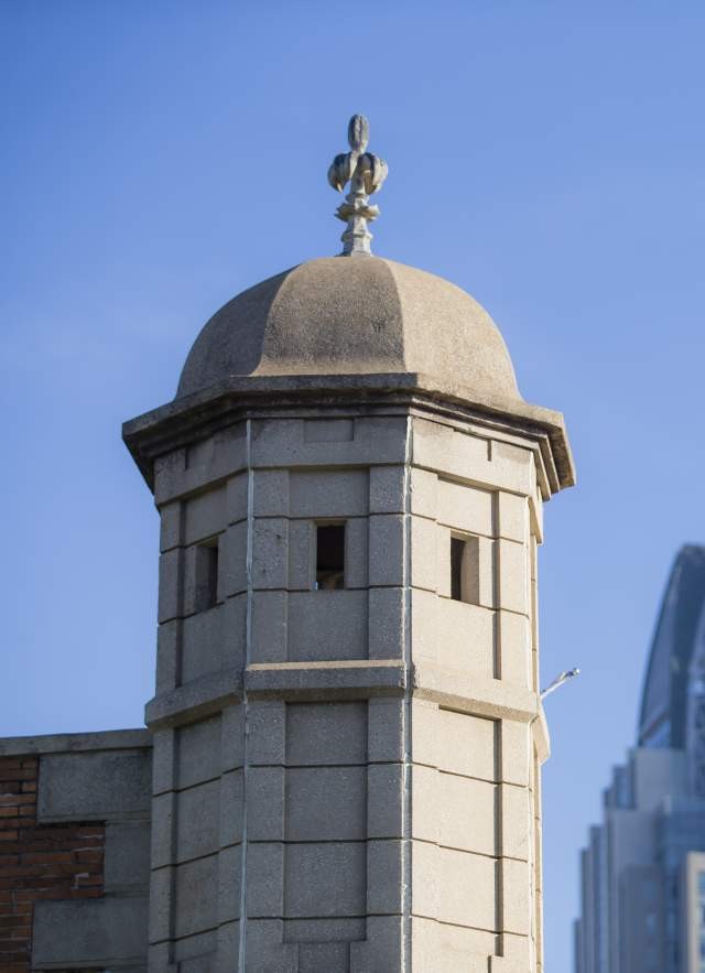 Colonial Fort Conde's spire stands tall against the backdrop of Mobile's skyscrapers