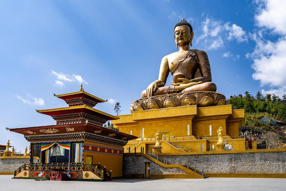 Buddha Dordenma Statue with blue sky in the background demonstrating Bhutan's peaceful atmosphere