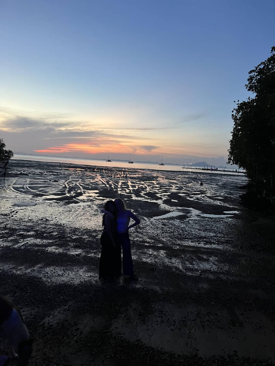 Under30Experiences Rachelle and Addison, watching the sunrise on their last morning in Thailand, feeling safe and content.
