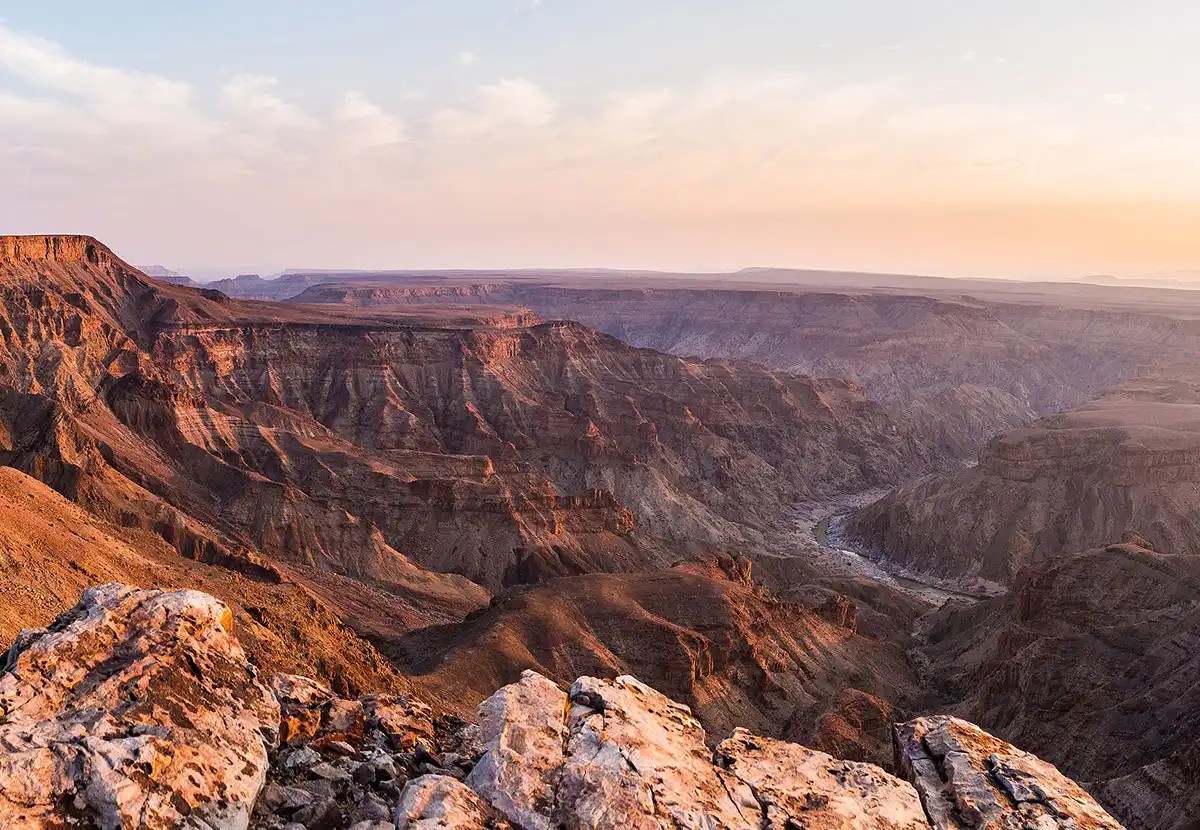 Fish River Canyon Namibia tourism attraction: A vast canyon landscape with quiver trees.