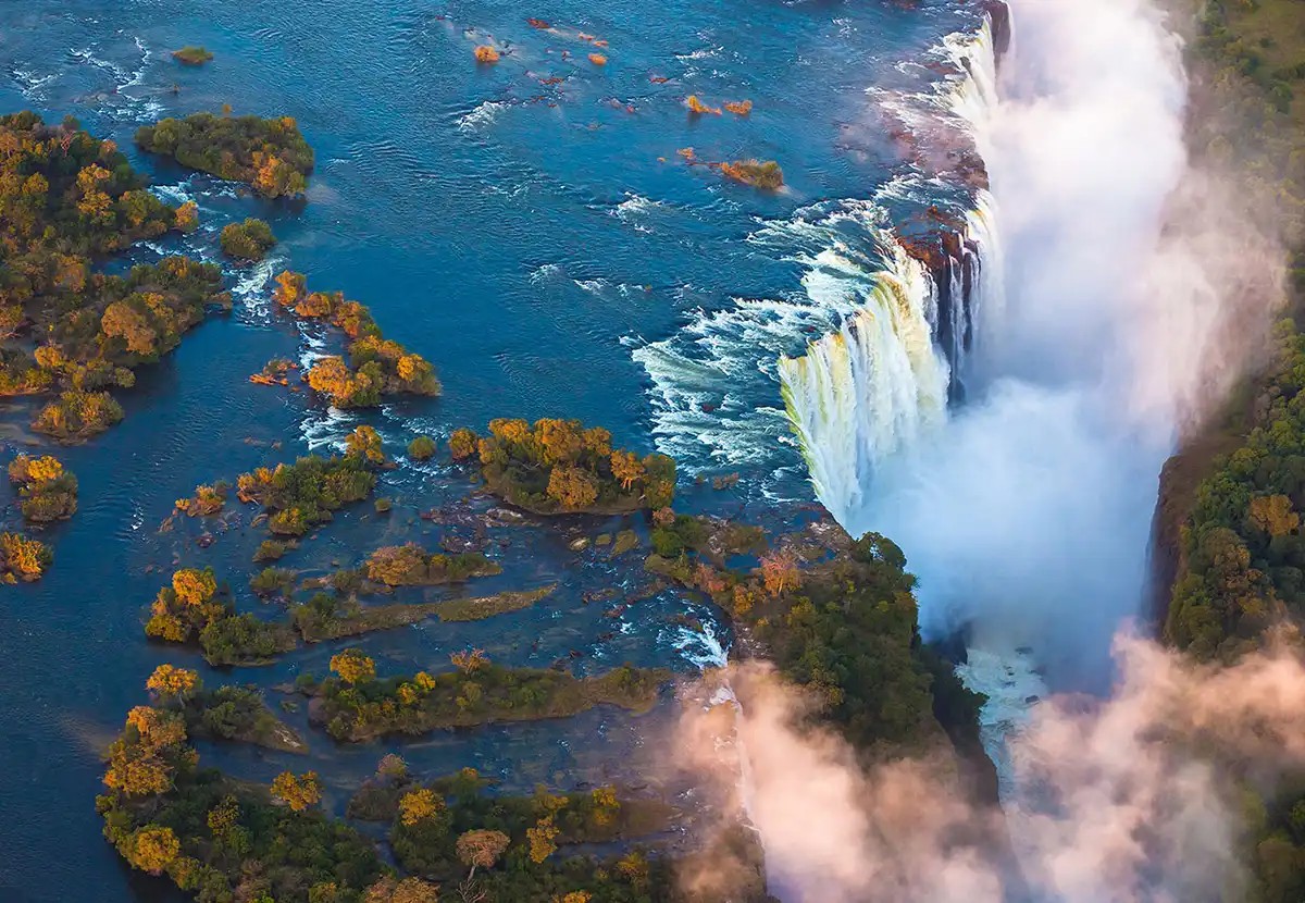 Victoria Falls Namibia tourism attraction: The Zambezi River plunging over a cliff.