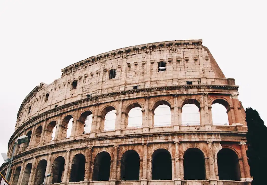 Ancient Roman Colosseum in Rome, Italy, with iconic arched architecture