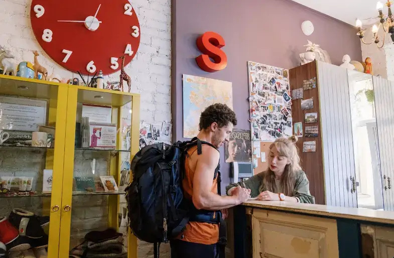 Two people talking in a colorful workspace