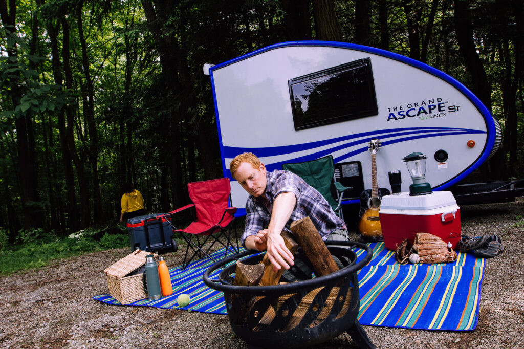 Aliner Grand Ascape travel trailer featuring a lightweight design and fiberglass exterior, making it fuel-efficient and easy to tow for modern camping enthusiasts.