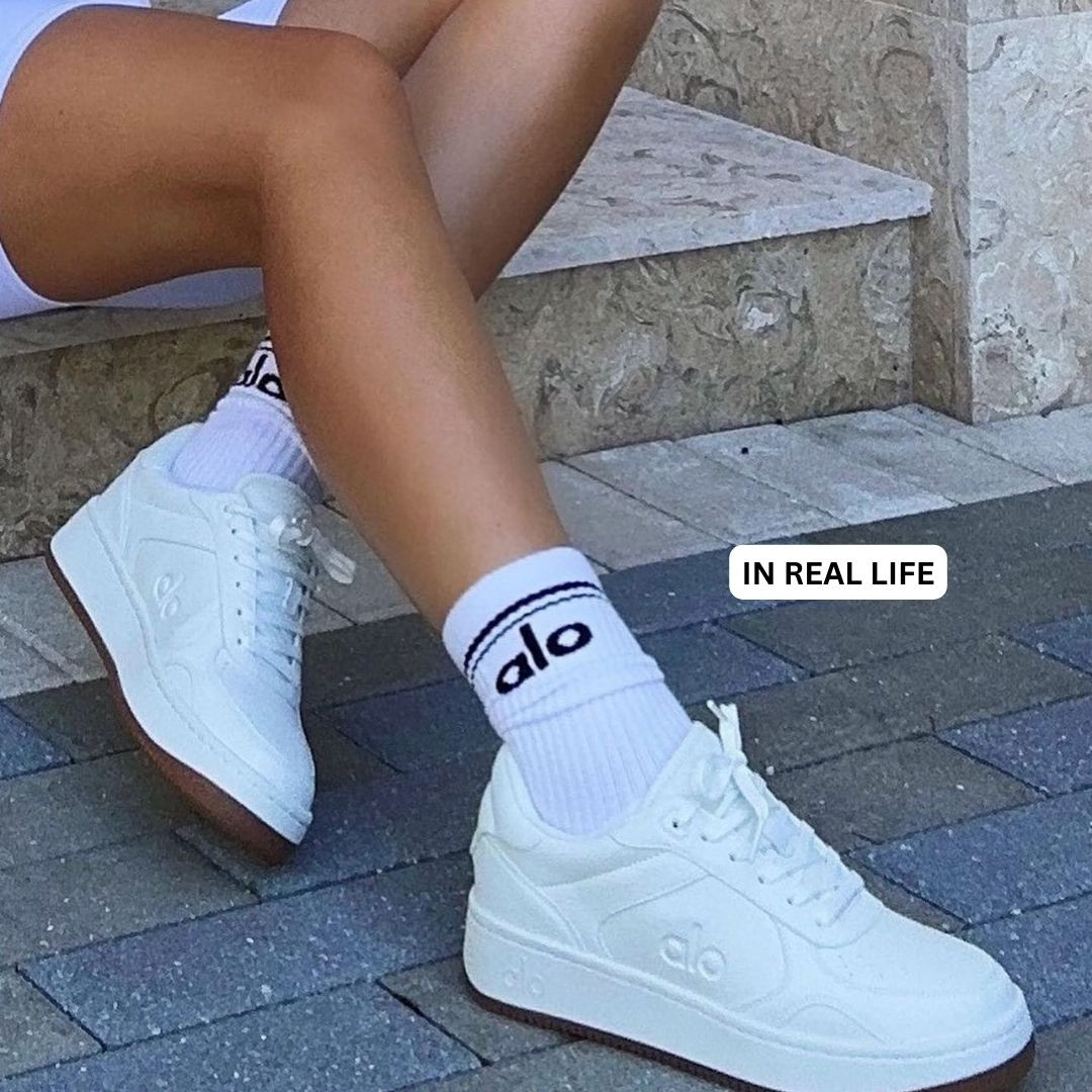 Alo white recovery sneakers with comfortable arch support, perfect for travel