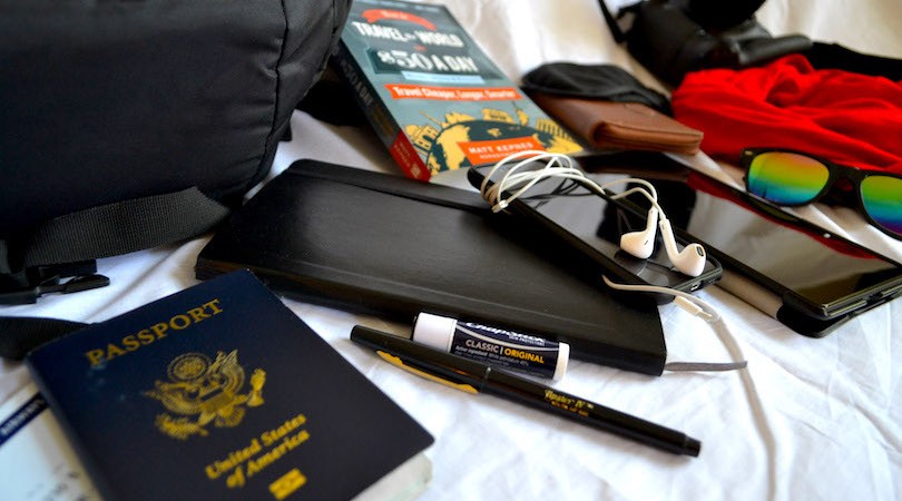Traveler packing a long-sleeved shirt for versatile layering