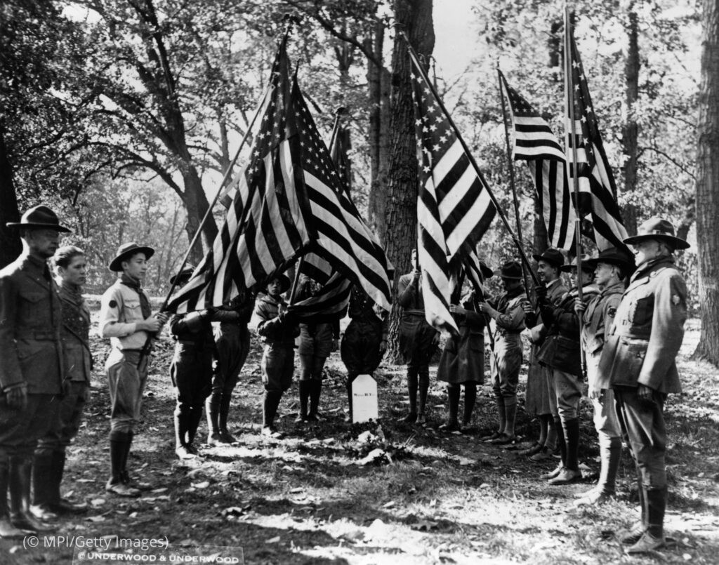 Boy Scouts holding American flags over the grave of former President William Howard Taft in 1930.