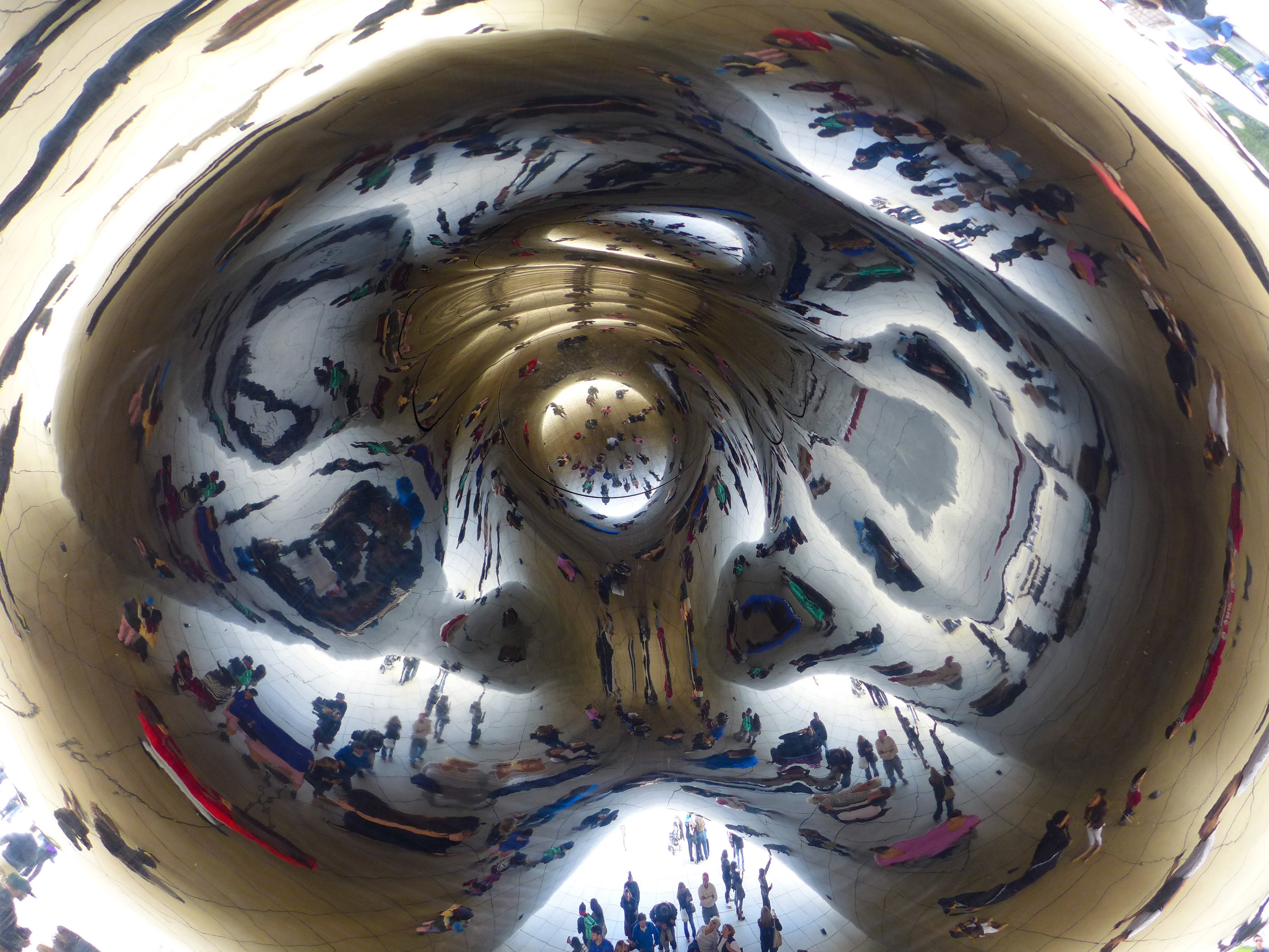 People taking photos in front of the Bean