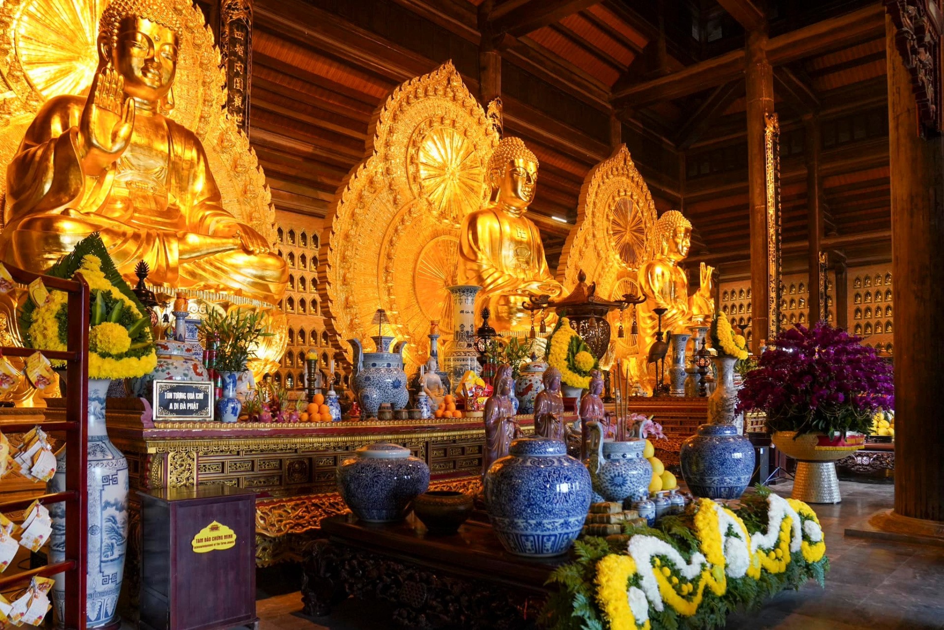 Bai Dinh Pagoda decorated with colorful lights and flowers for Tet, creating a festive atmosphere, blending cultural traditions with religious observances