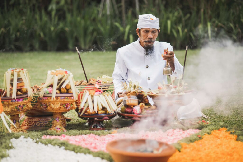 Balinese monk on traditional spiritual ceremony showing respect and appreciation for the local culture