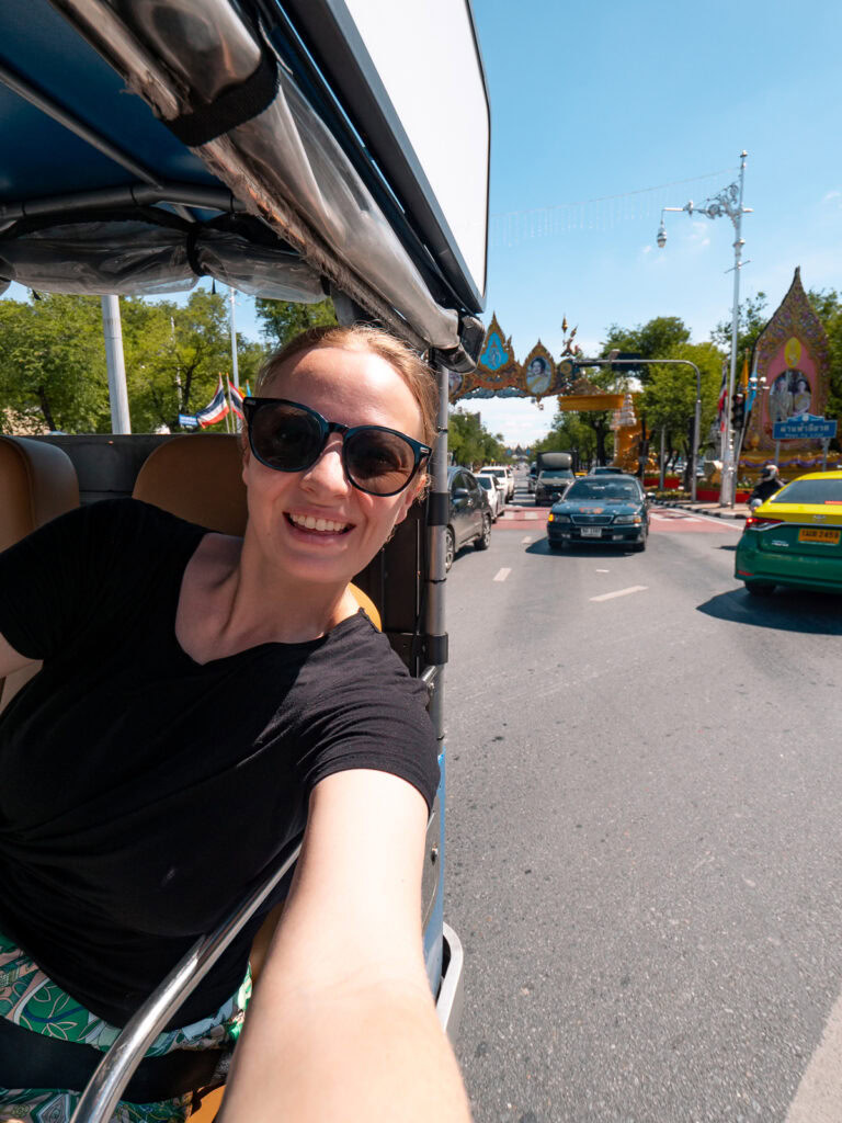 Woman confidently exploring a bustling Bangkok street market