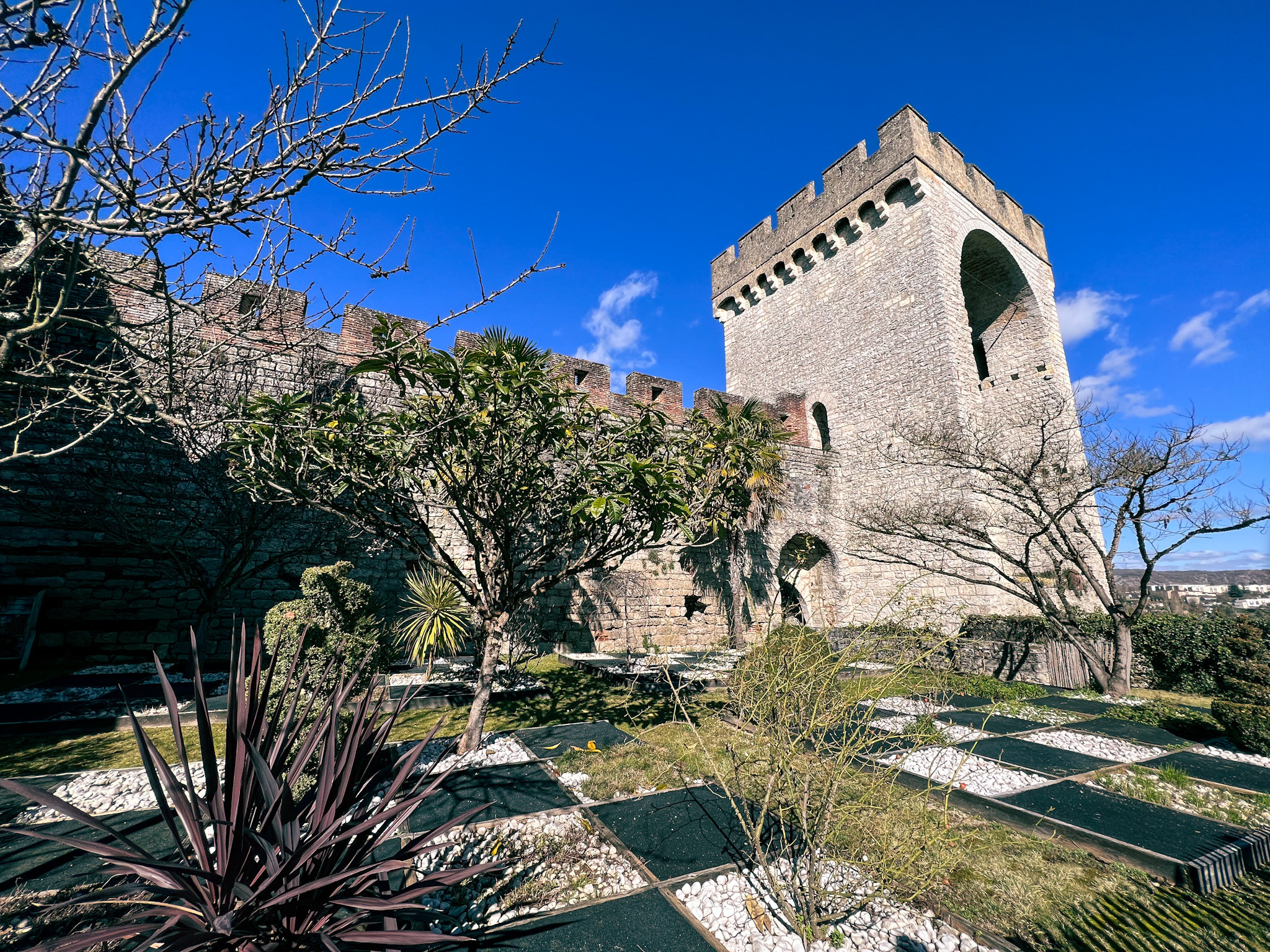 Garden at La Barbacane in Cahors, blending historical architecture with natural beauty