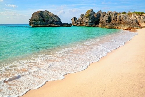 beautiful beach with waves in warwick long bay in bermuda