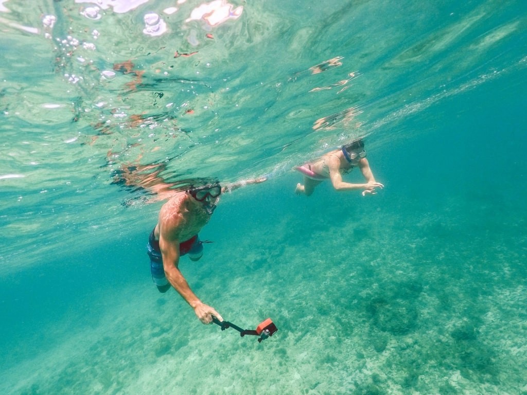 People snorkeling in the clear waters of St. Thomas
