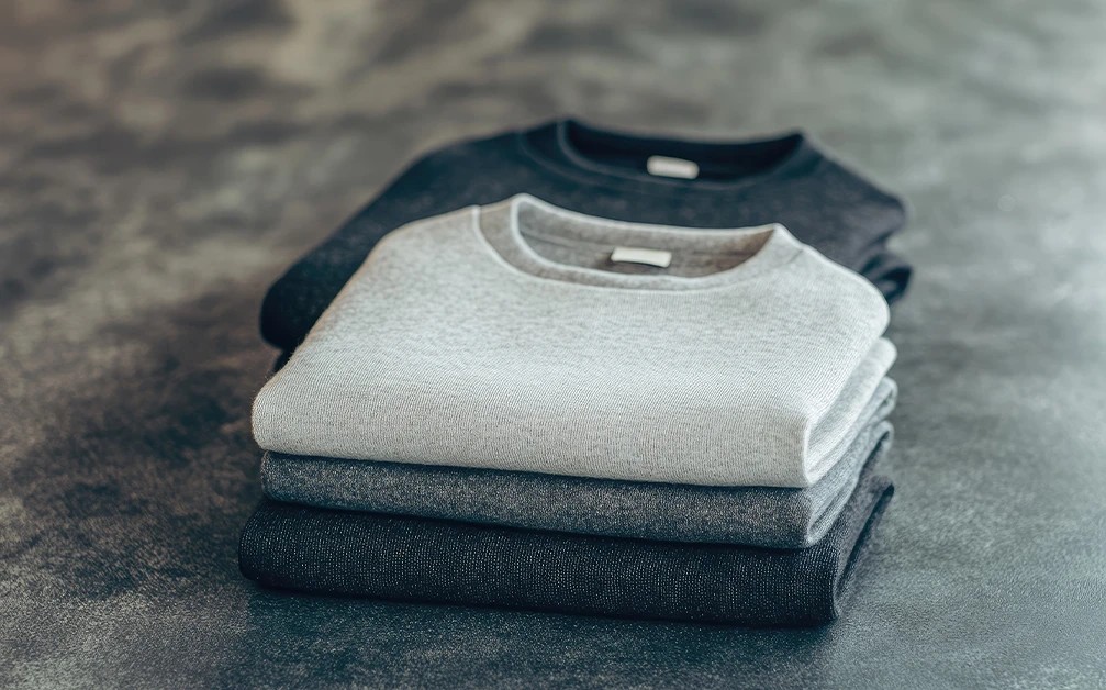 Organized sweatshirts in a drawer