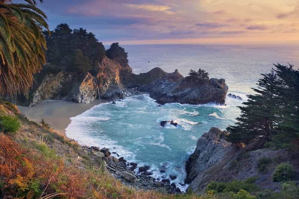 Big Sur, California offering twisty roads, stunning cliffs, rocky shores, a handful of gorgeous sandy beaches and superb ocean views all backed by thick redwood forests.