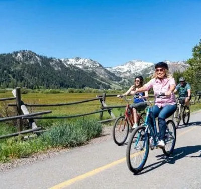 Kayaking in Lake Tahoe's crystal-clear waters, surrounded by stunning mountain scenery.