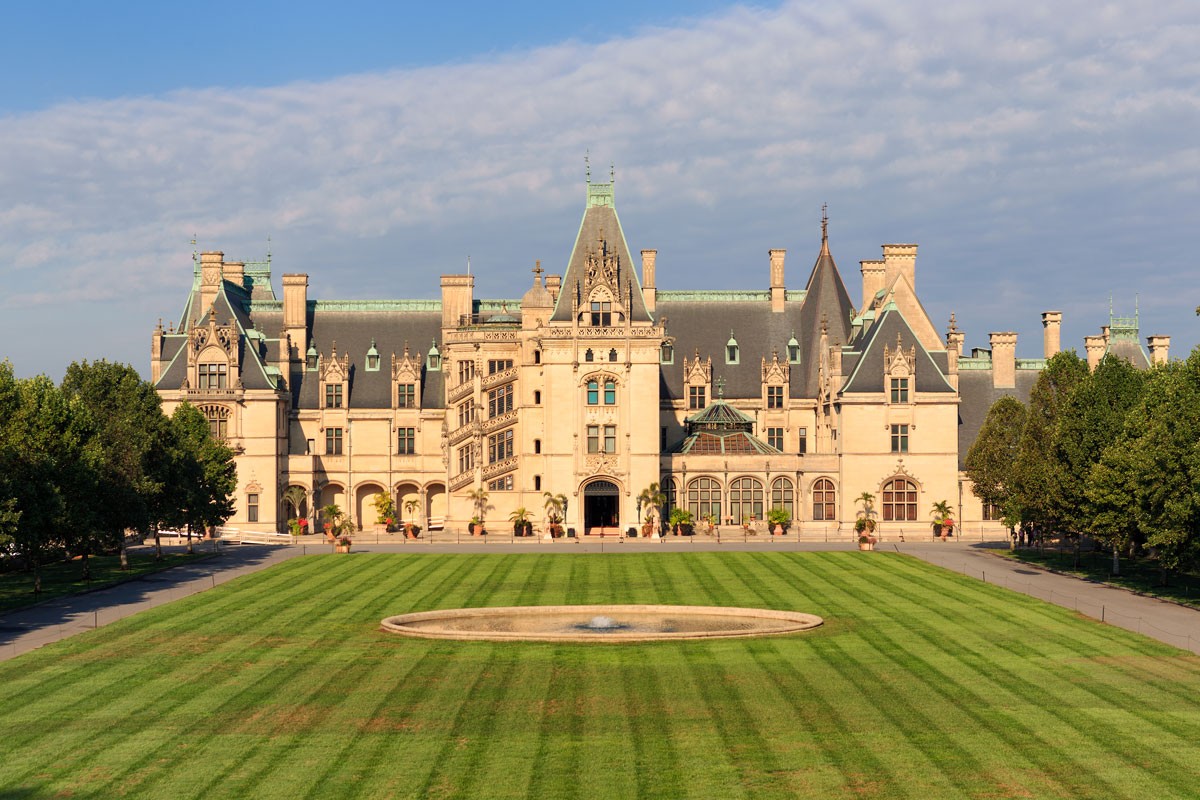 A stately home in a lush, green field, Biltmore Estate in Asheville, North Carolina