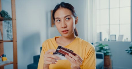 Man reloading his prepaid travel card using a mobile app